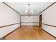 Formal dining room with hardwood floors and elegant chandelier at 80 Country Roads Dr, Stockbridge, GA 30281