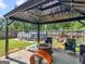Relaxing patio with fire pit, pool, and wicker furniture at 10 Toscanno Dr, Covington, GA 30014