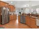 Spacious kitchen with stainless steel appliances and hardwood floors at 10 Toscanno Dr, Covington, GA 30014