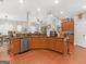 Large kitchen with an island, stainless steel appliances, and hardwood floors at 10 Toscanno Dr, Covington, GA 30014