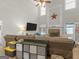 Spacious living room featuring a fireplace and a large sectional sofa at 10 Toscanno Dr, Covington, GA 30014