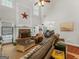 Living room with stone fireplace and lots of natural light at 10 Toscanno Dr, Covington, GA 30014