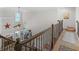 Upstairs hall overlooking living room with railing at 10 Toscanno Dr, Covington, GA 30014