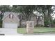 Brick house with a two-car garage and mature trees at 4768 Redbranch Rd, Decatur, GA 30035
