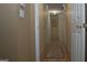 Long hallway with carpeted floor and multiple doors at 4768 Redbranch Rd, Decatur, GA 30035