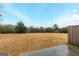 Large backyard with small patio and treeline view at 3170 Fareed St, Douglasville, GA 30135