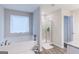 Relaxing bathroom with soaking tub and walk-in shower at 3170 Fareed St, Douglasville, GA 30135