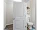 Small bathroom with toilet and pedestal sink at 3170 Fareed St, Douglasville, GA 30135