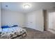 Spacious bedroom with double doors and carpeted floor at 3170 Fareed St, Douglasville, GA 30135