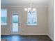 Bright dining room with hardwood floors and access to the backyard at 3170 Fareed St, Douglasville, GA 30135