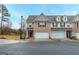 Two-story townhome with brick facade and two-car garage at 3170 Fareed St, Douglasville, GA 30135