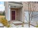 Townhome entry with burgundy door and stone accents at 3170 Fareed St, Douglasville, GA 30135