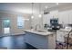 Modern kitchen with white cabinets and granite island at 3170 Fareed St, Douglasville, GA 30135