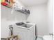 Laundry room with washer, dryer, and overhead shelving at 3170 Fareed St, Douglasville, GA 30135