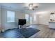 Open concept living room with access to kitchen and backyard at 3170 Fareed St, Douglasville, GA 30135