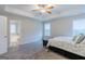 Main bedroom with ceiling fan, carpet, and ensuite bathroom access at 3170 Fareed St, Douglasville, GA 30135