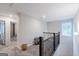 Upstairs hallway with carpet flooring and access to bedrooms at 3170 Fareed St, Douglasville, GA 30135
