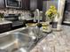 Modern kitchen sink and faucet with a stylish design at 6828 Delta Dr, Riverdale, GA 30274