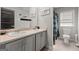 Well-lit bathroom with double sinks, toilet and shower at 1752 Alford Dr, Jonesboro, GA 30236