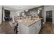 Kitchen island with granite countertop, stainless steel sink, and gray cabinets at 1752 Alford Dr, Jonesboro, GA 30236