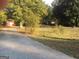 Ranch house with a detached building, chain link fence, and large yard at 1810 Highway 138 E, Stockbridge, GA 30281