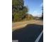 Road view near a treeline and residential area at 1810 Highway 138 E, Stockbridge, GA 30281