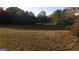 Open grassy vacant lot bordered by trees at 1810 Highway 138 E, Stockbridge, GA 30281