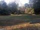Vacant lot with grassy area and trees in the background at 1810 Highway 138 E, Stockbridge, GA 30281