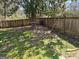 Fenced backyard with mature tree offers privacy and outdoor space for relaxing and entertaining at 1551 Ferno Nw Dr, Atlanta, GA 30318
