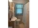 Cozy bathroom with tiled walls, a vanity sink, and decorative elements at 1551 Ferno Nw Dr, Atlanta, GA 30318