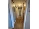 Neutral hallway with multiple doors and laminate flooring at 1551 Ferno Nw Dr, Atlanta, GA 30318