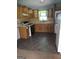 Functional kitchen features appliances and wood cabinets at 1551 Ferno Nw Dr, Atlanta, GA 30318