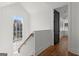 Modern staircase with wooden handrail and a view from the top at 245 2Nd St, Fayetteville, GA 30214