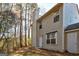 Tan two-story house with white trim and attached garage at 845 Hillandale Ln, Lithonia, GA 30058