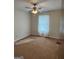 Well-lit bedroom with carpet and ceiling fan at 3772 Saddle Ridge Dr, Snellville, GA 30039