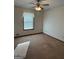 Cozy carpeted bedroom with window and ceiling fan at 3772 Saddle Ridge Dr, Snellville, GA 30039