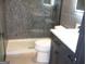 Contemporary bathroom featuring a pebble tile shower and freestanding tub at 4490 Latchwood Dr, Lithonia, GA 30038