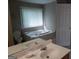 Bathroom features a vanity, toilet and garden tub at 4767 Glenwhite Dr, Duluth, GA 30096