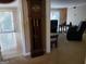 Entryway with a grandfather clock and view into the living room at 4767 Glenwhite Dr, Duluth, GA 30096