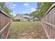 Large backyard with a fenced-in area and grassy lawn at 701 Brambling Way, Stockbridge, GA 30281