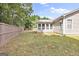 House exterior showcasing a sunroom and fenced backyard at 701 Brambling Way, Stockbridge, GA 30281