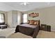 Primary bedroom with king-size bed and ample closet space at 701 Brambling Way, Stockbridge, GA 30281