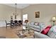 Bright dining area with hardwood floors and stylish light fixture at 701 Brambling Way, Stockbridge, GA 30281