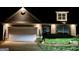 Night view of charming home with well-lit exterior at 701 Brambling Way, Stockbridge, GA 30281