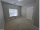 Bright bedroom featuring neutral walls and carpeted floors at 101 Spring Heights Ln, Smyrna, GA 30080