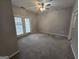 Spacious bedroom with carpet, French doors, and ceiling fan at 101 Spring Heights Ln, Smyrna, GA 30080