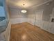 Simple dining area with wood floors and white wainscoting at 101 Spring Heights Ln, Smyrna, GA 30080