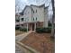 Beige two-story condo building with brick base and landscaping at 101 Spring Heights Ln, Smyrna, GA 30080