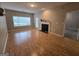 Living room with fireplace, wood floors, and patio access at 101 Spring Heights Ln, Smyrna, GA 30080