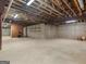 Unfinished basement with wood stove and ample storage shelving at 95 Fern Ct, Stockbridge, GA 30281